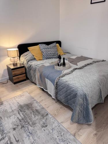 a bedroom with a bed and a table with two cats on it at Helenka Loft House 24H - Zabrze blisko A1, Arena Gliwice 15 min in Zabrze