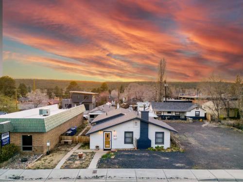 an aerial view of a home under a cloudy sky at Uptown Estates - Peak Haven - Stay Explore Belong in Flagstaff