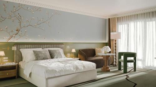 een slaapkamer met een wit bed en een stoel bij Ardour Milton Park Bowral in Bowral