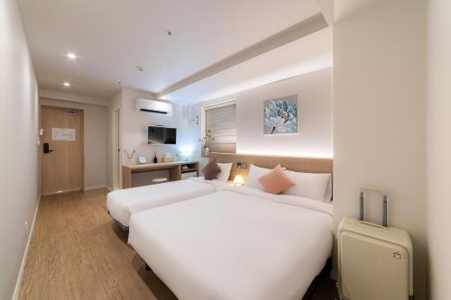 Ένα ή περισσότερα κρεβάτια σε δωμάτιο στο 하이 동대문 호스텔