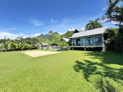 a house with a large lawn in front of it at villa inspiration in Ko Chang
