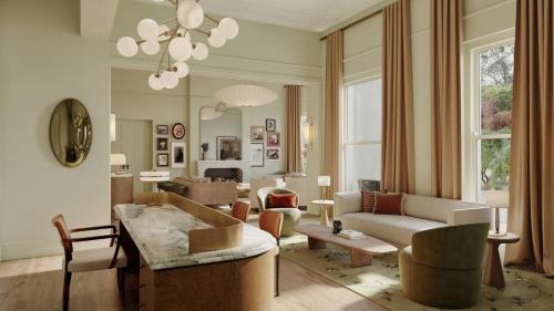 een woonkamer met een bank en een tafel bij Ardour Milton Park Bowral in Bowral