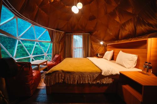 Ένα ή περισσότερα κρεβάτια σε δωμάτιο στο Pelaga Eco Park