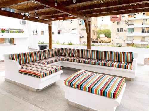 a patio with two couches sitting on a roof at Hotel Playamar in Mazatlán