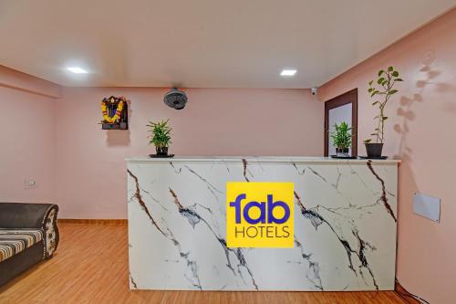 a lobby with a table with a yellow sign on it at Via The Heaven in Pune