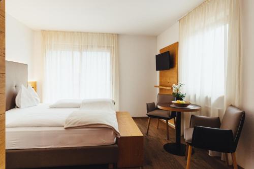 Postel nebo postele na pokoji v ubytování Hotel Schmuckhof