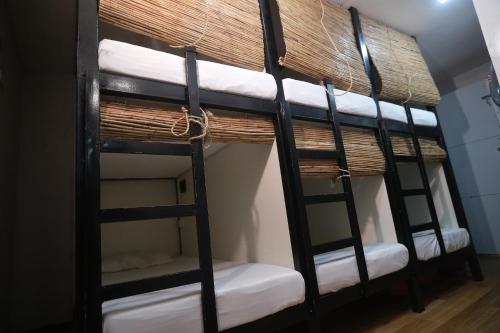 a group of bunk beds in a room at Haidoville in General Luna