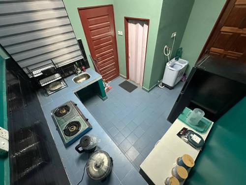 Η κουζίνα ή μικρή κουζίνα στο D umie Homestay