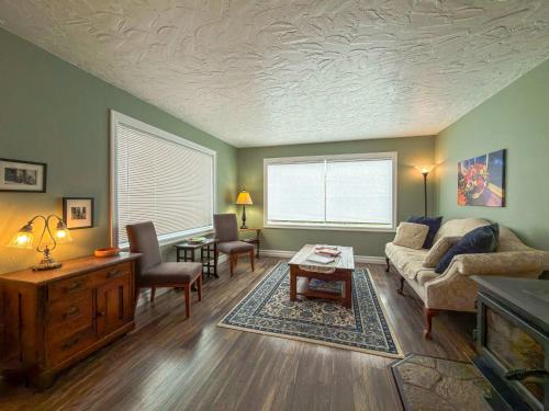 a living room with a couch and a table at The Garden Gate in R Corner