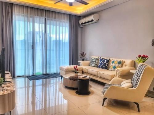 a living room with a couch and chairs at R&F Princess Cove 3BR CozyDesign JB Central CIQ in Johor Bahru
