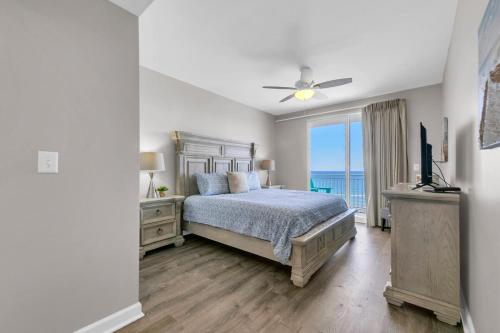 een slaapkamer met een bed en uitzicht op de oceaan bij Beachfront Condo in Panama City Beach! in Panama City Beach