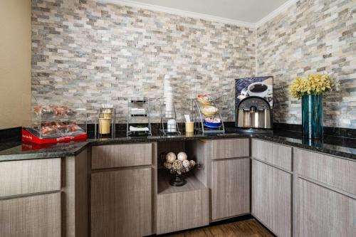 a kitchen with a counter top in a room at Days Inn by Wyndham Canton in Canton