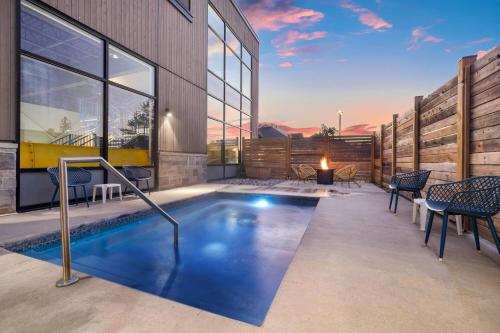a swimming pool in the backyard of a house at Microtel Inn & Suites by Wyndham Mont Tremblant in Mont-Tremblant