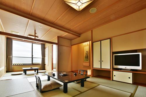 TV a/nebo společenská místnost v ubytování 天空海遊の宿 末広