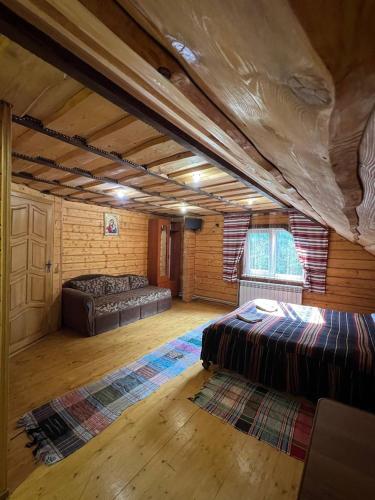 Ένα ή περισσότερα κρεβάτια σε δωμάτιο στο Лісова тиша номер - 1