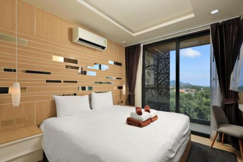 Postel nebo postele na pokoji v ubytování Stylish apartments in Calypso Garden condo, Sea View!