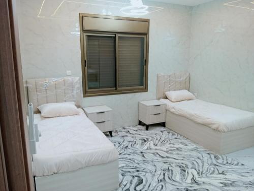 Vuode tai vuoteita majoituspaikassa جرادات للشقق المفروشه