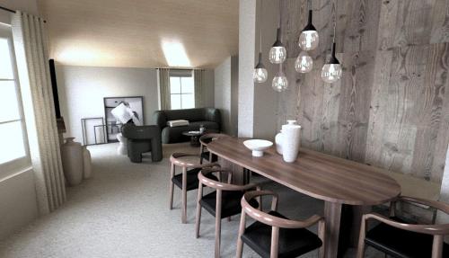 a living room with a wooden table and chairs at fuchs am meer in Mitterhofen