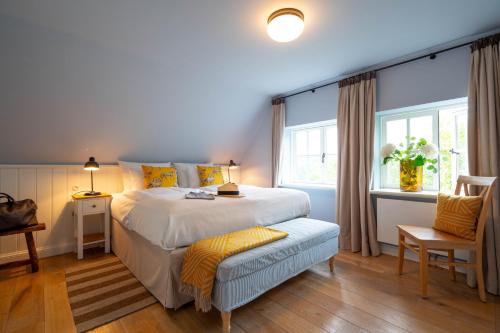 En eller flere senge i et værelse på Ferienwohnung Gut Immenhof