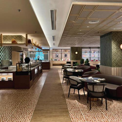 a restaurant with tables and chairs in a room at Grand Mercure Kuala Lumpur Bukit Bintang in Kuala Lumpur