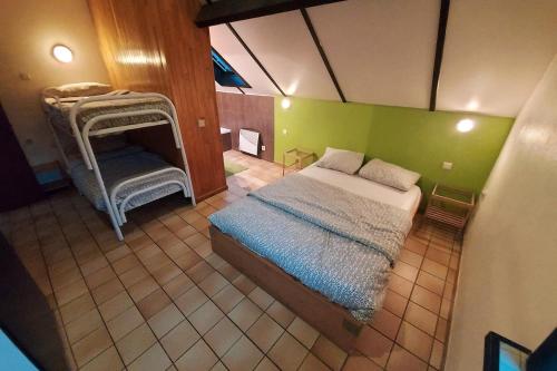 an overhead view of a bedroom with a bed and a chair at Gîte du sanglier in Durbuy