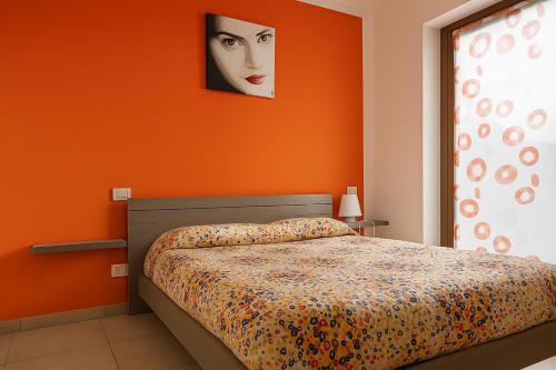 Postel nebo postele na pokoji v ubytování Le Colline di Maggiora B&B