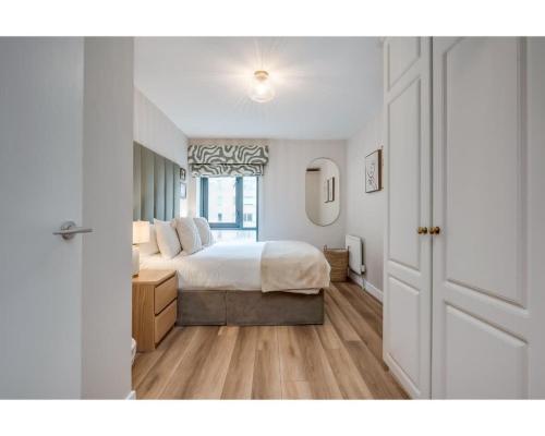 Ένα ή περισσότερα κρεβάτια σε δωμάτιο στο Central Belfast Apartments: Citygate