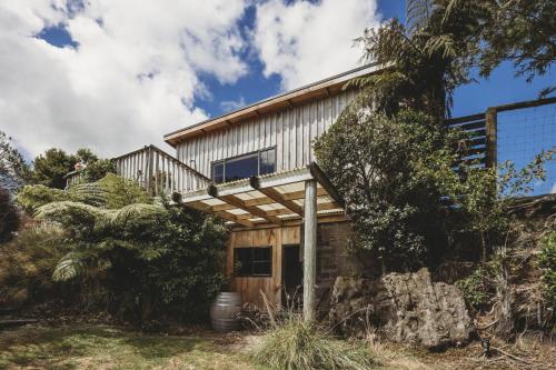 a house on the side of a mountain at The River Retreat - off the grid escape in Inglewood