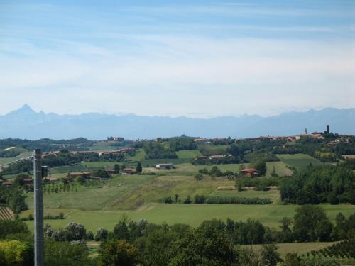 a view of a green valley with mountains in the background at il Balcone sul Monferrato in Tonco