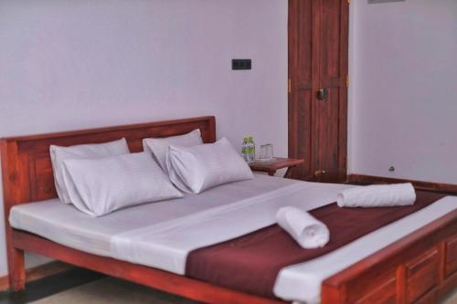 En eller flere senge i et værelse på Yala Masan Hideout