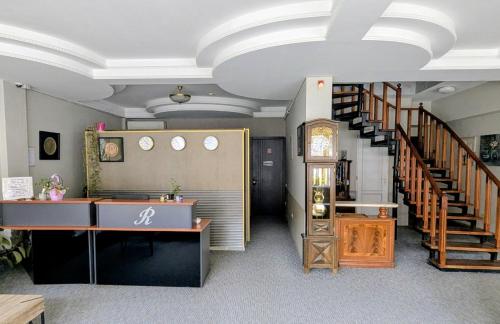 a large room with a staircase and a stair case at The Rogashome in Tbilisi City