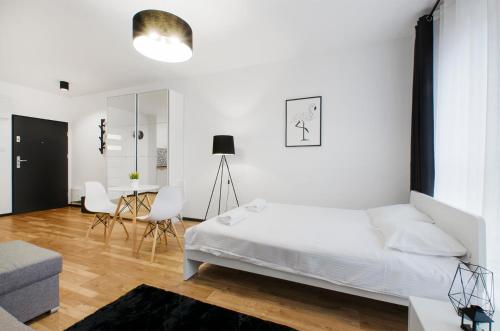 Postel nebo postele na pokoji v ubytování ApartHouse Deluxe