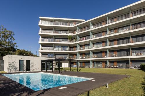 Swimmingpoolen hos eller tæt på Antas Park with pool and gym - to work & leisure