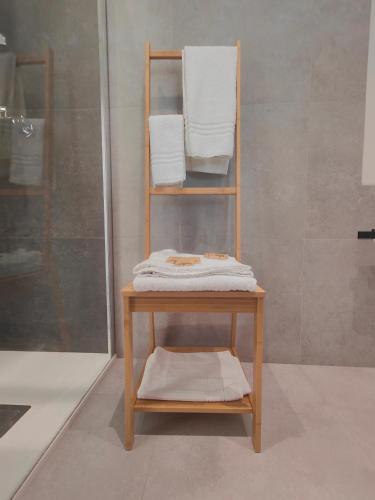 a towel rack with towels on it in a bathroom at Agriturismo Pentafora in Marmirolo
