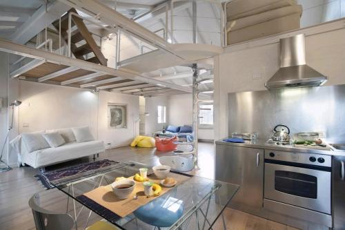 a large kitchen with a table in a room at Locappart Cannaregio - Venice City Centre in Venice