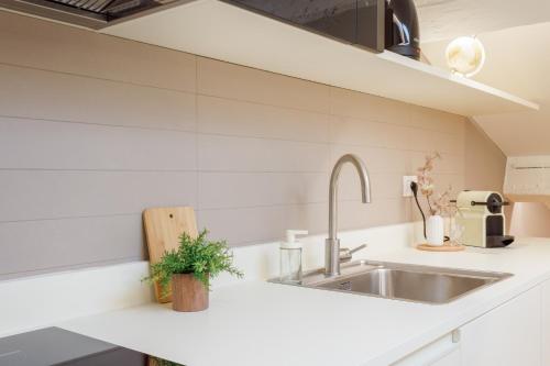 Kuchyň nebo kuchyňský kout v ubytování Corso Adriano 13 - Via Emilia