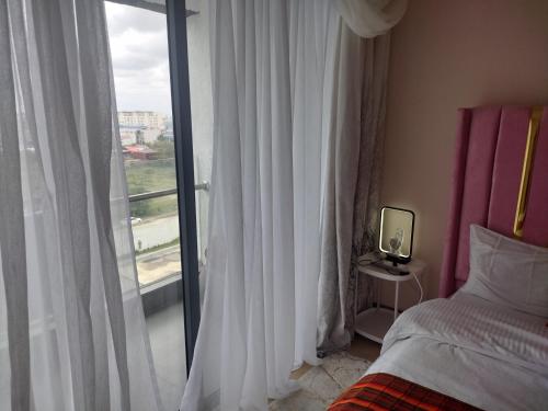 Postel nebo postele na pokoji v ubytování Lenayan at Artesano