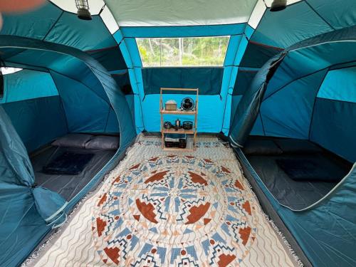 a blue tent with a table inside of it at D'River Luxcamp 