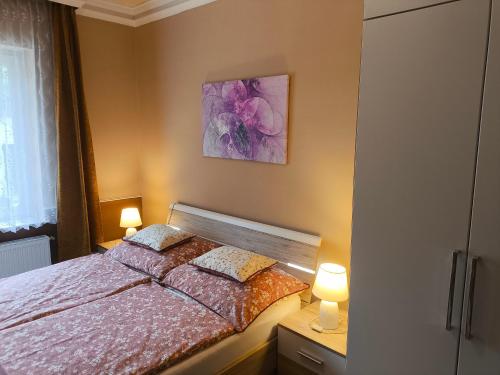 Postel nebo postele na pokoji v ubytování Pilis Apartman