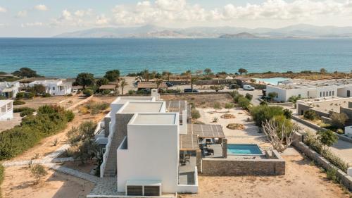an aerial view of the house and the ocean at Vastblue of Paros in Ambelas