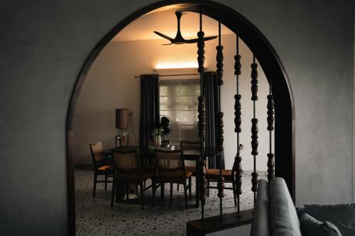 a dining room with a table and a large mirror at Coastline 4Bedroom cliffside villa in Elattūr