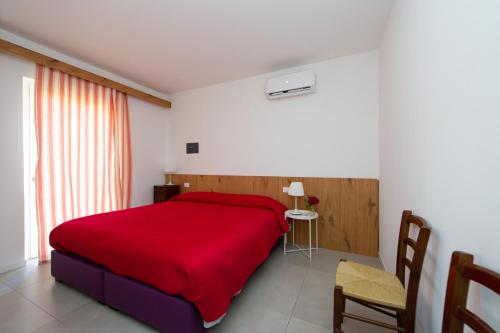 Ένα ή περισσότερα κρεβάτια σε δωμάτιο στο B&b Stregatto dalla Luna