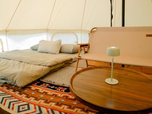Ένα ή περισσότερα κρεβάτια σε δωμάτιο στο BASECAMP森林基地 I Glamping豪華露營-海拔820 雲海山嵐星空