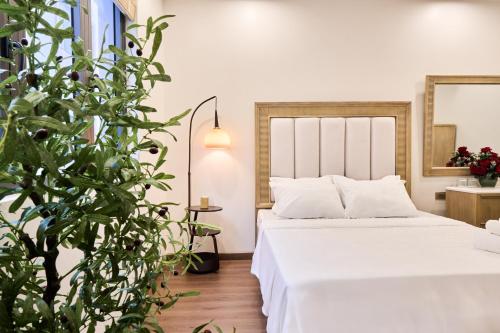 Postel nebo postele na pokoji v ubytování The Lumen Stay - Vinhomes Ocean Park 3