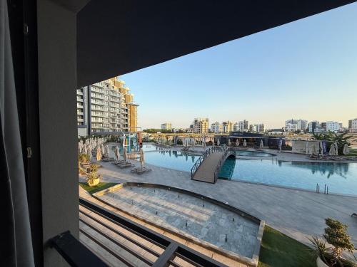 a view of a swimming pool from a window at Riverside Life Residence in Iskele