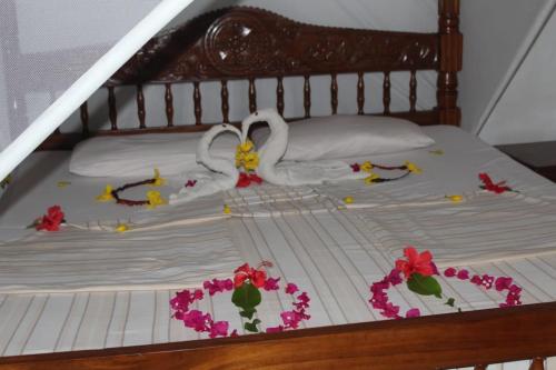 Postel nebo postele na pokoji v ubytování Blue House Watamu