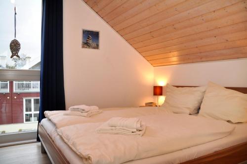 Voodi või voodid majutusasutuse NordseeResort Friesland NordseeResort Friesland 3 toas