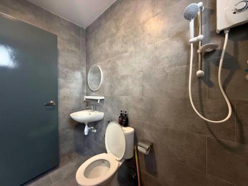 a bathroom with a shower and a toilet and a sink at Midlands City Broga Semenyih by ASDEH Suites in Semenyih