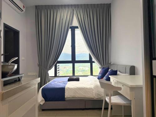 a bedroom with a bed and a desk and a window at Midlands City Broga Semenyih by ASDEH Suites in Semenyih