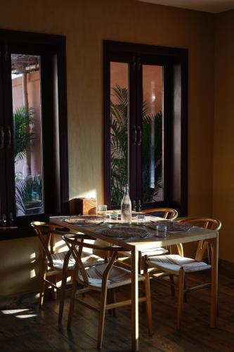 a dining room with a table and chairs at Liwa Nights ليالي ليوا in Liwa